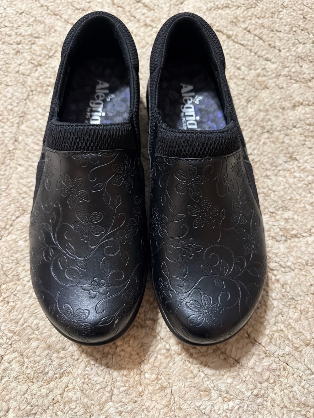 Alegria Black Embossed Floral Slip-On Clogs